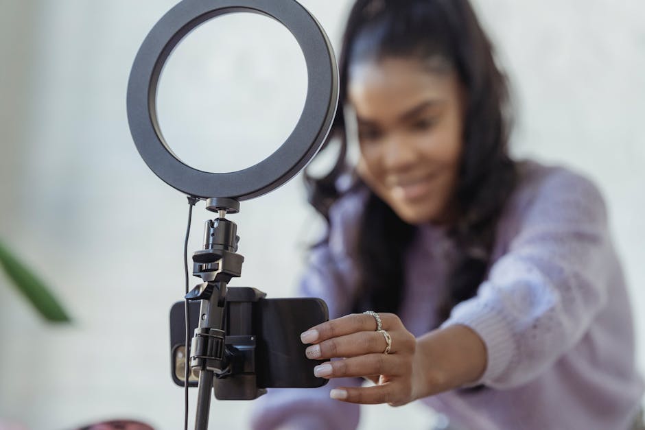 A content creator recording a video in a home studio setup