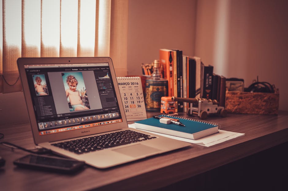 A freelancer working on their laptop in a comfortable home office setting, looking focused and engaged in their work.