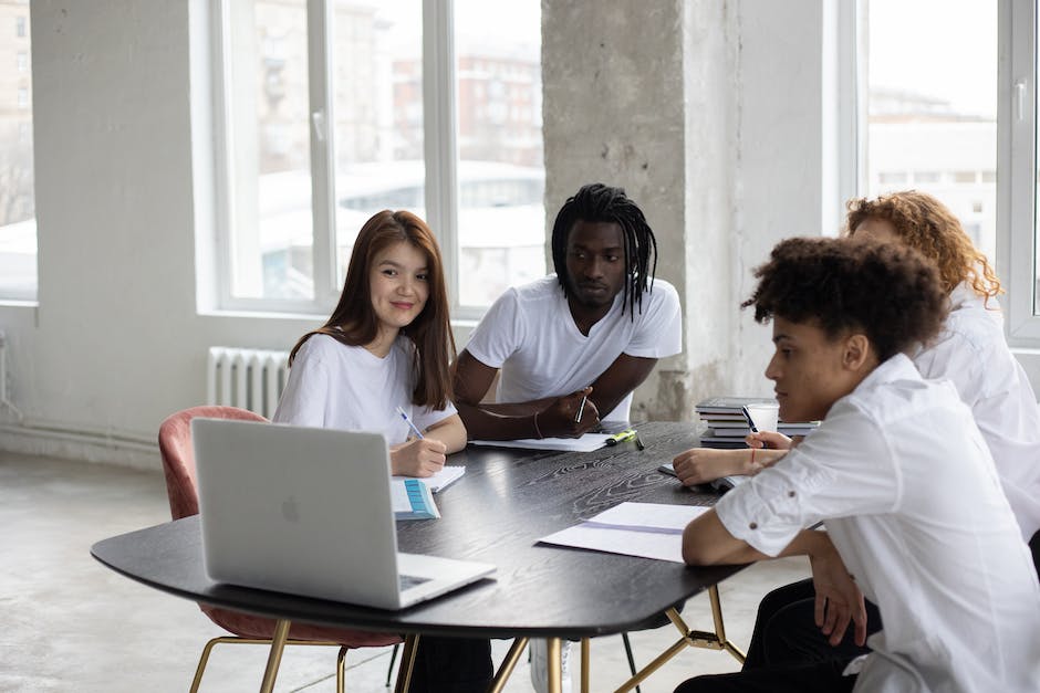 A group of people sitting at different computers, symbolizing online learning