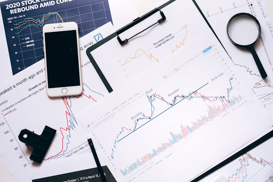 A social media manager's workspace with multiple devices and analytics charts